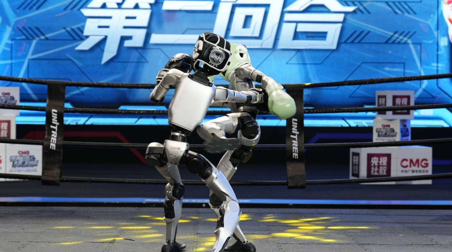 彩神vll高燃开赛一拳KO 宇树机器人格斗首秀：高对抗性下人机协同成核心点(图1)